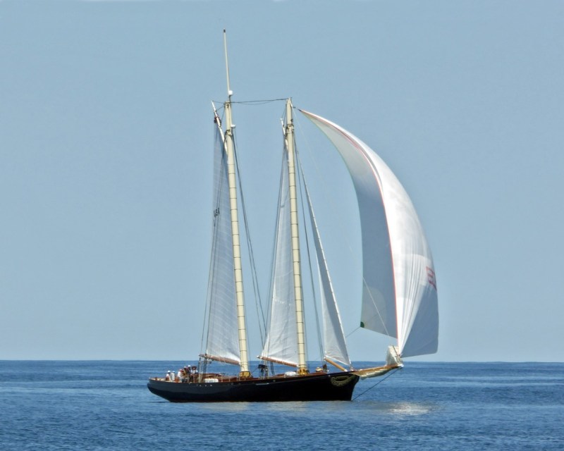 America-with-Spinnaker a large ship in a body of water