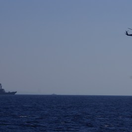 Helicopter and Navy Ship