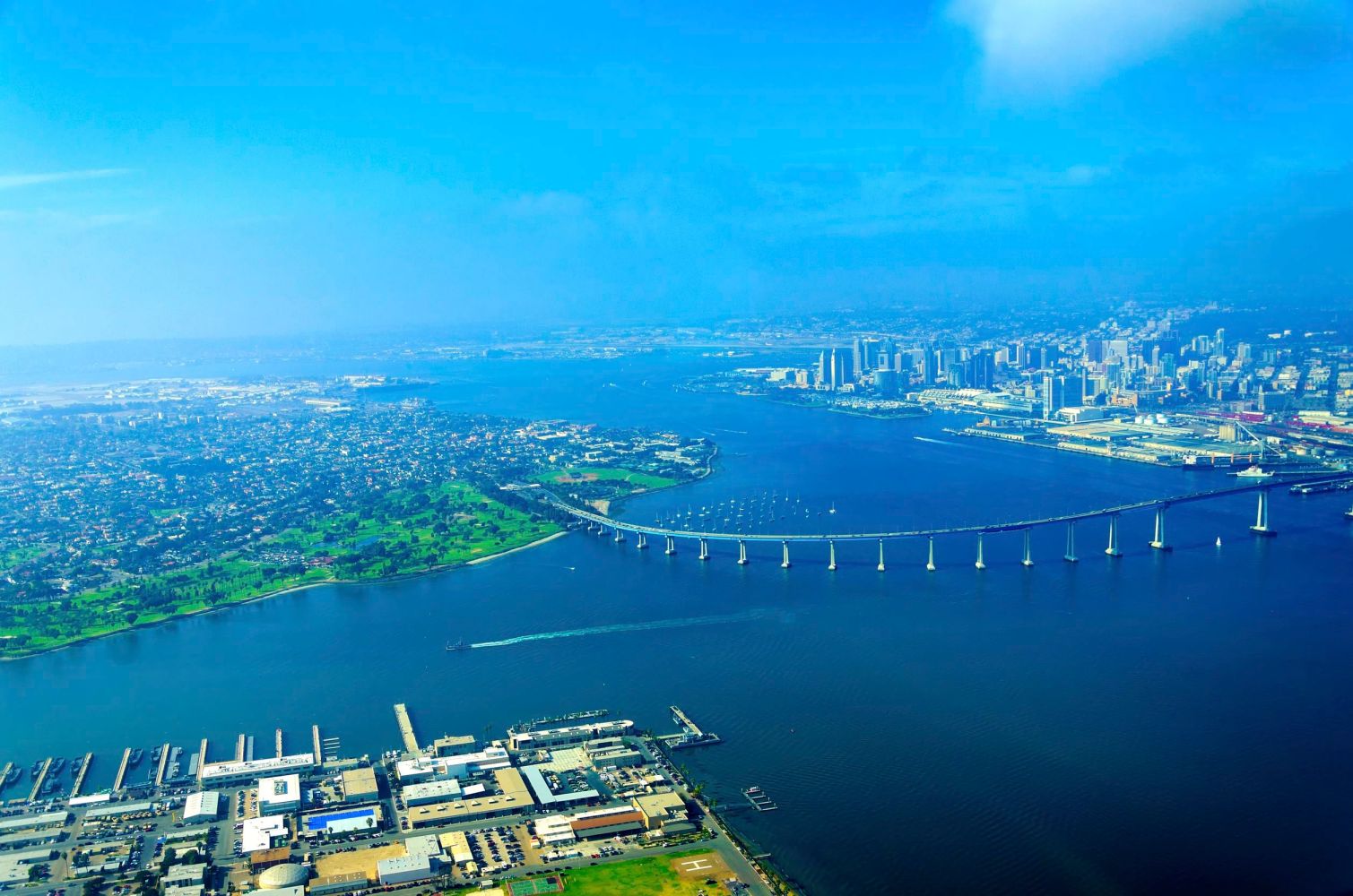 a view of a large body of water with a city in the background