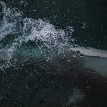 a person riding a wave on a surfboard in the water