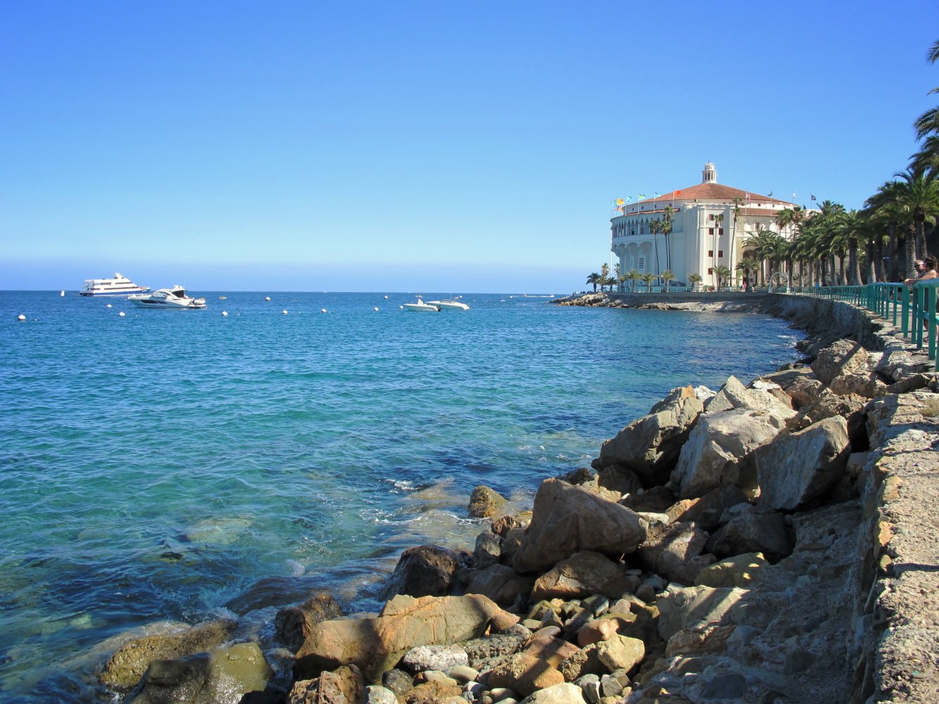 a rocky shore next to a body of water