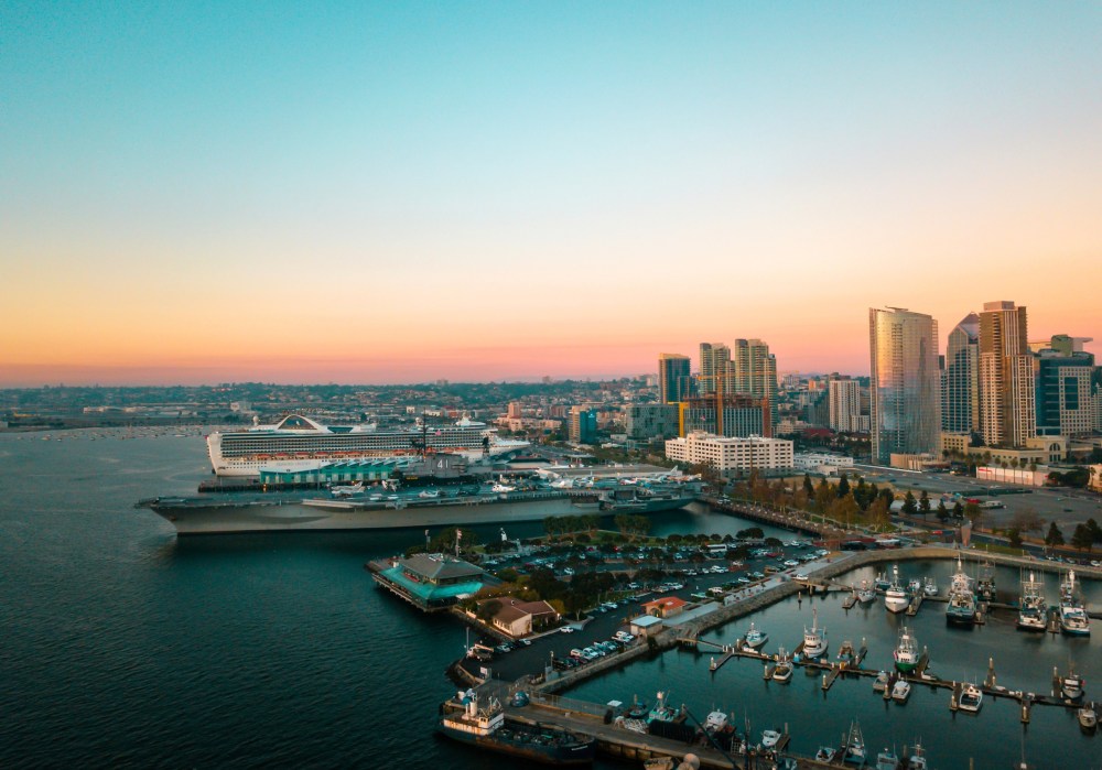 a body of water with a city in the background