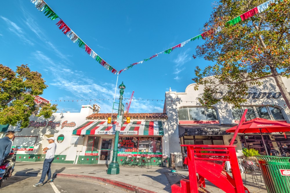a person flying a kite in a city