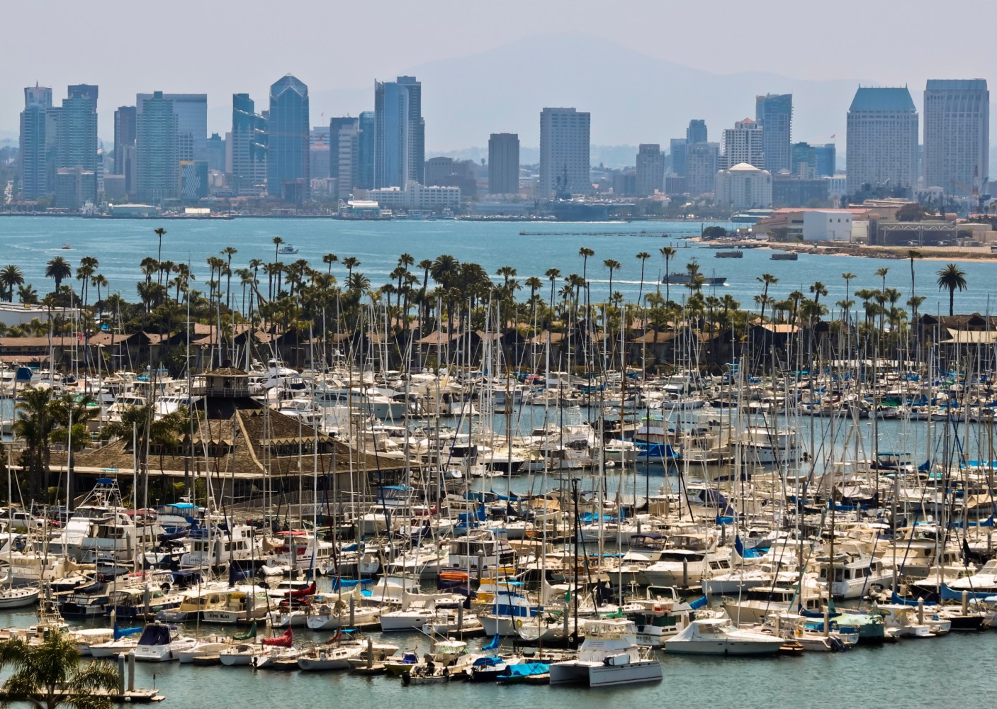 a large body of water with a city in the background