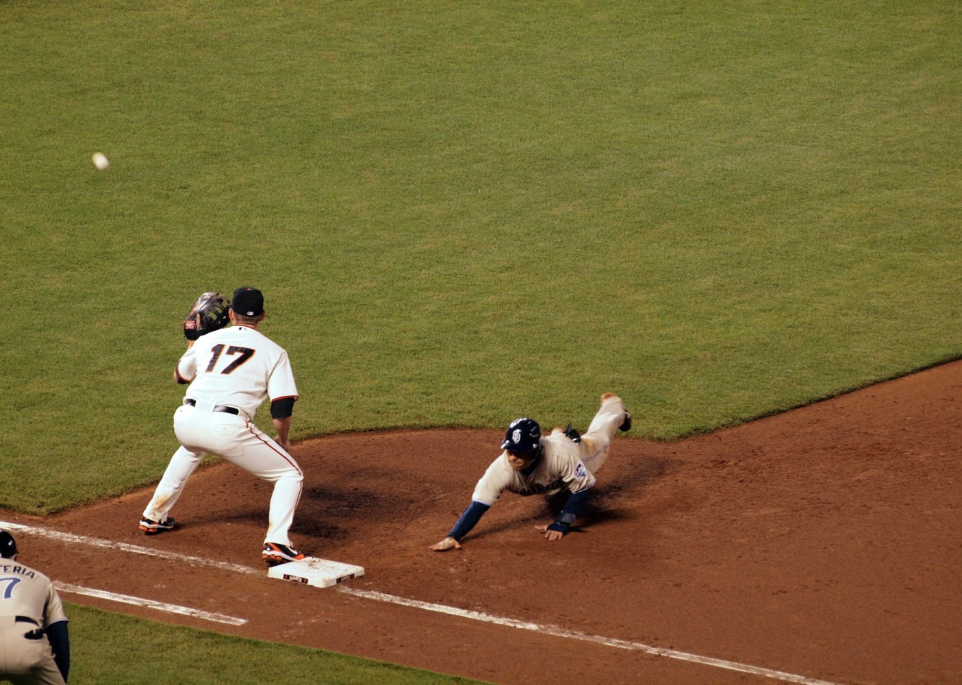 a baseball player throwing a ball during a game