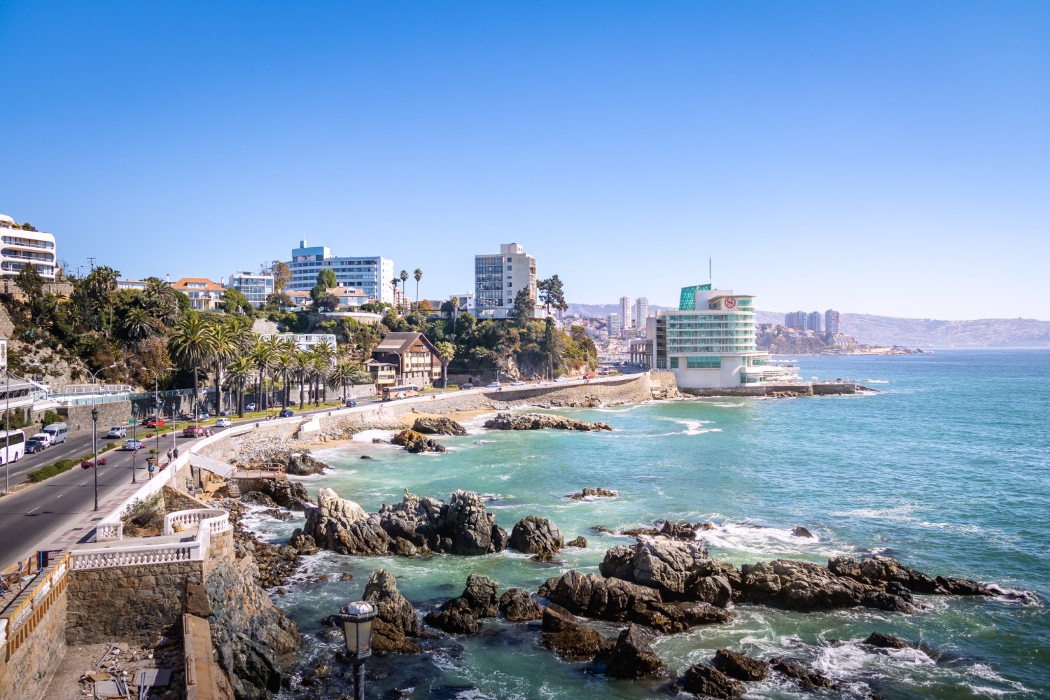 a body of water with a city in the background