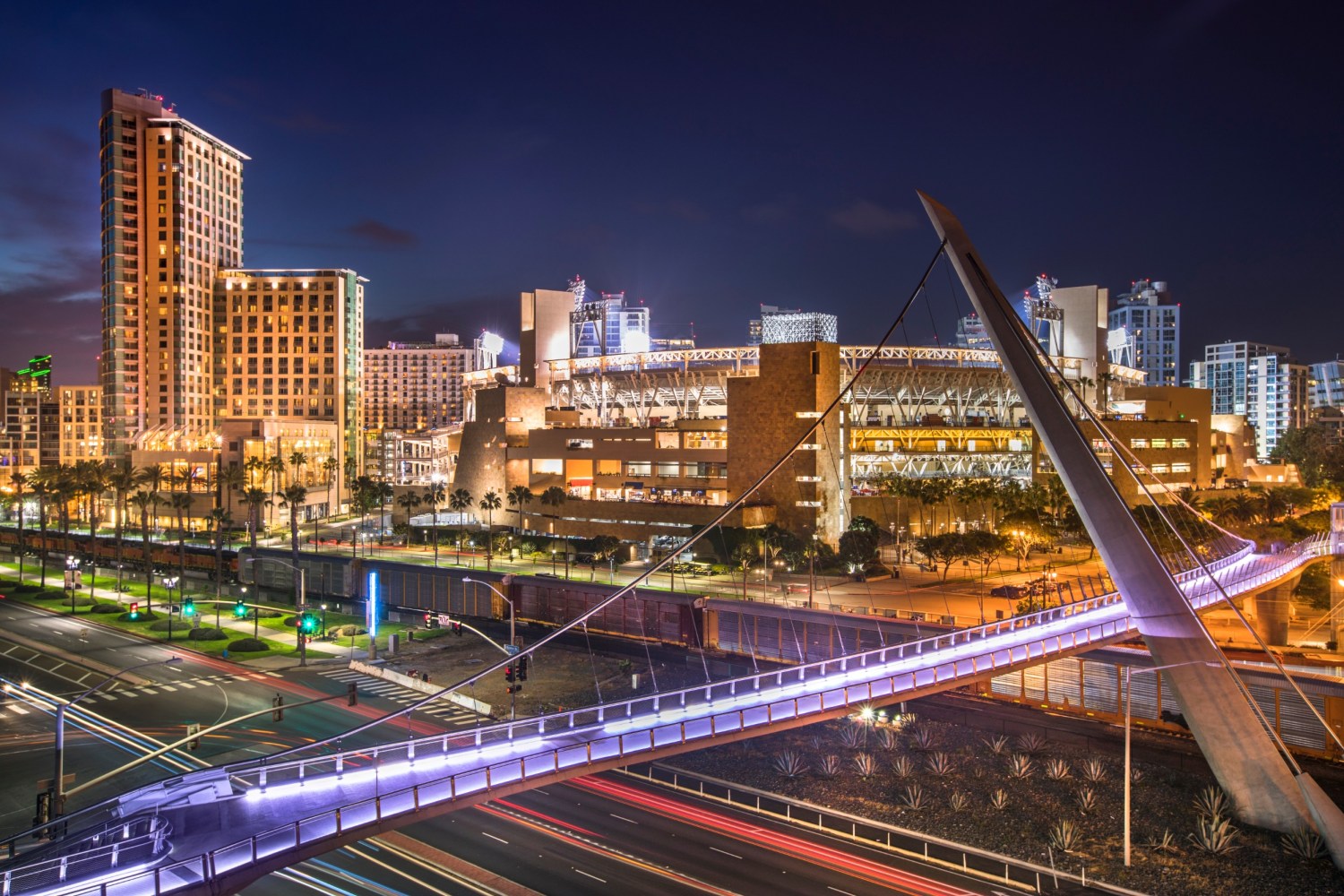 a view of a city with a bridge in the background