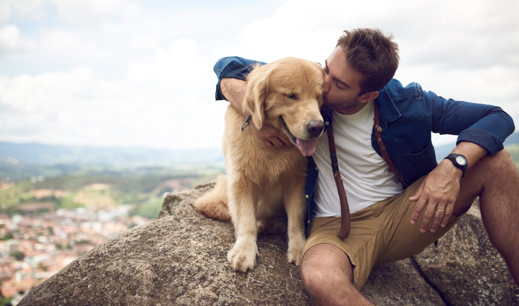 a man holding a dog