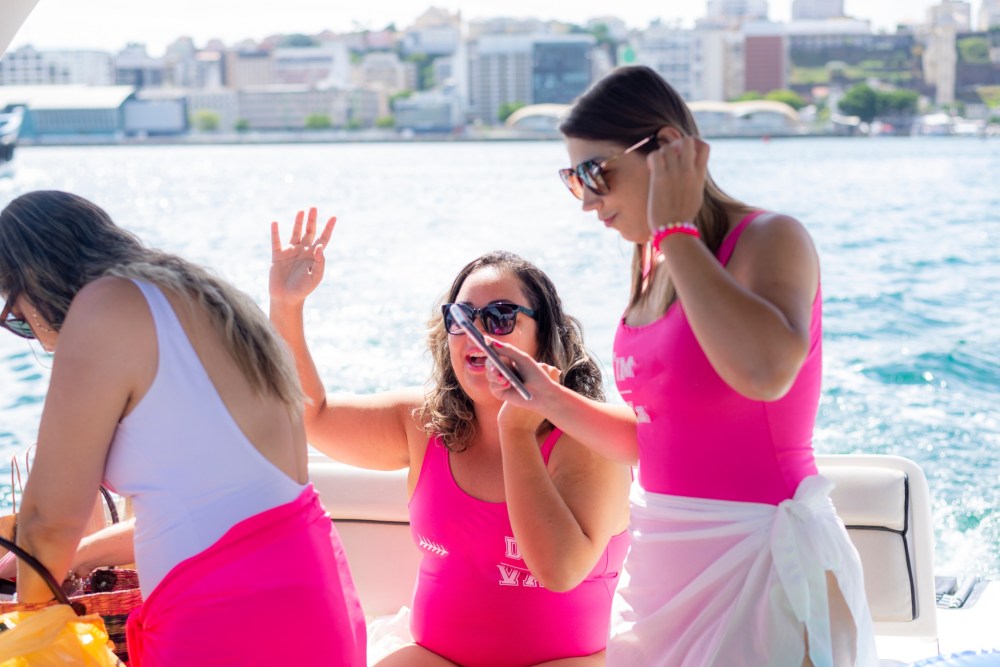 a woman standing in front of water