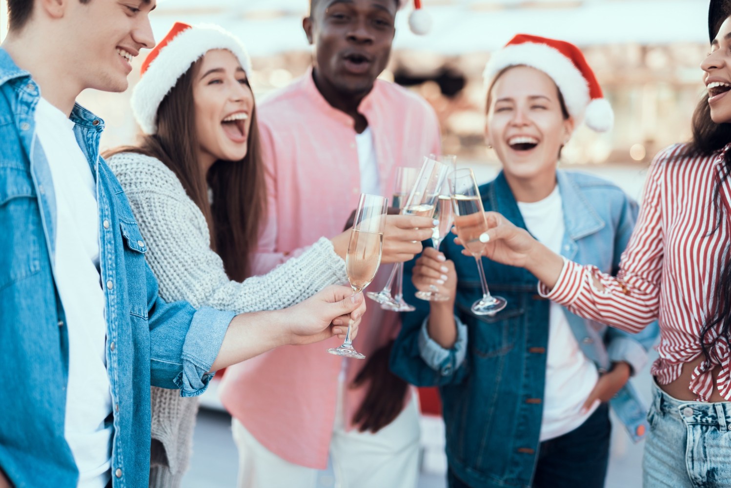 a group of people holding wine glasses