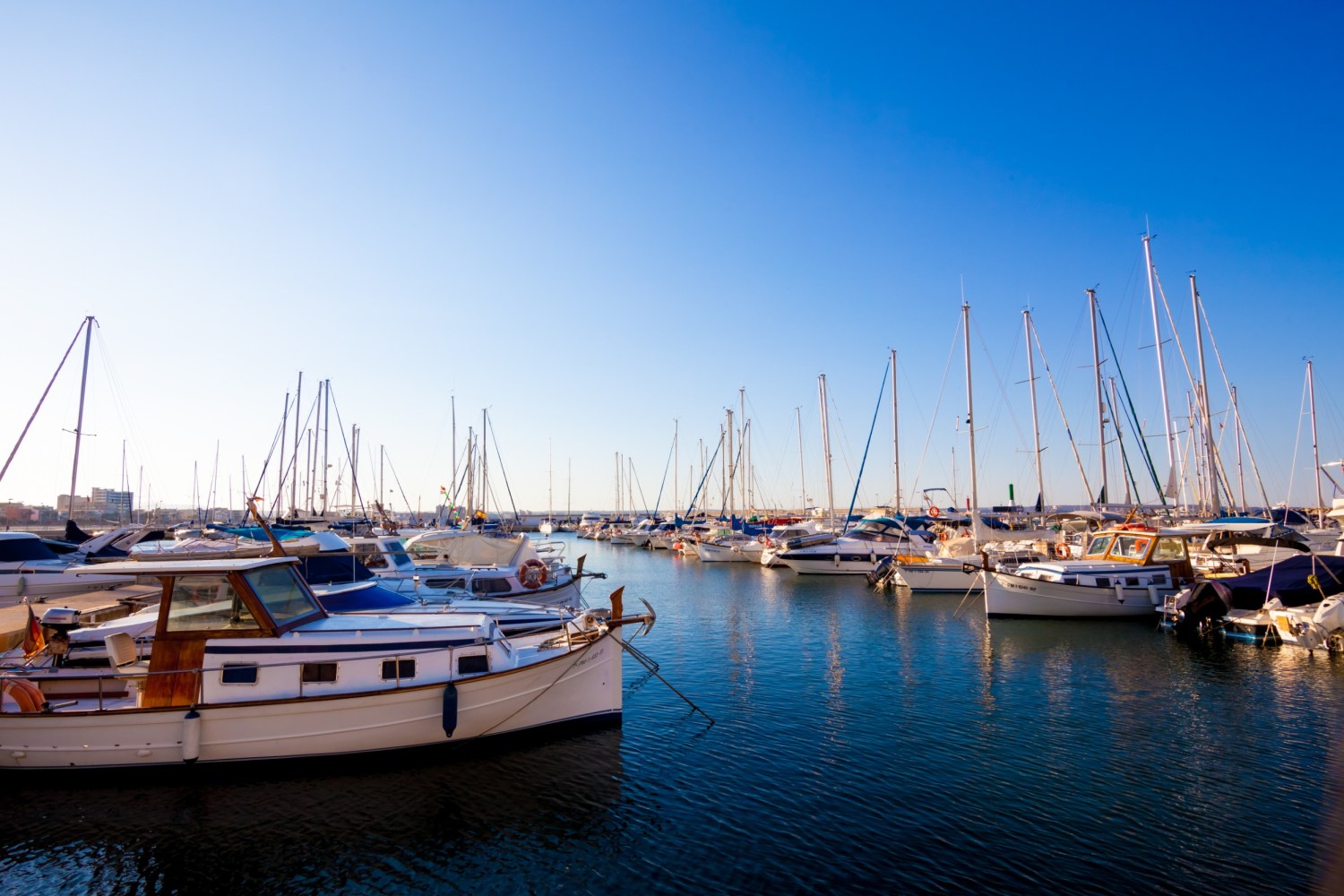 a boat is docked next to a body of water