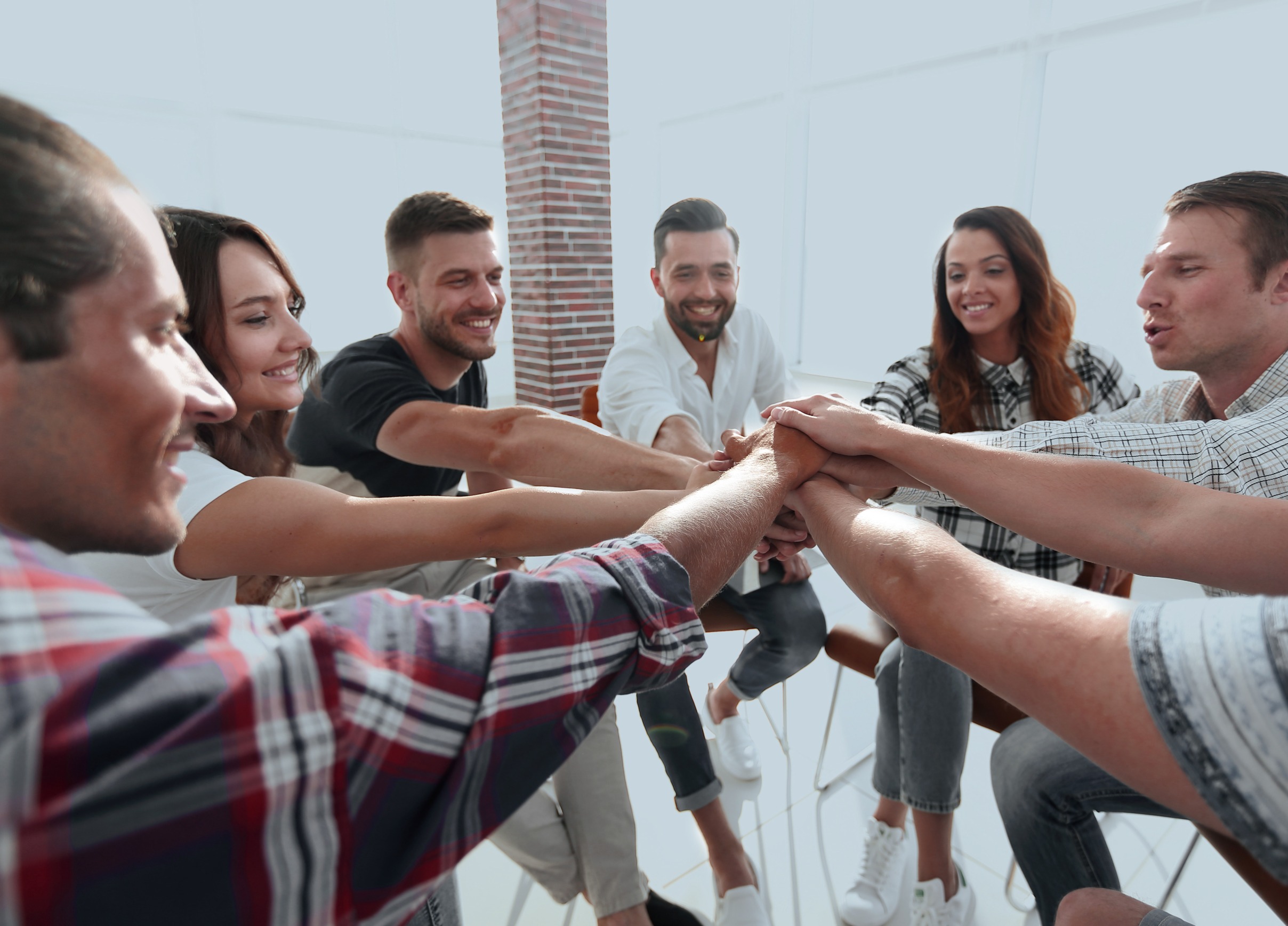 a group of people around each other